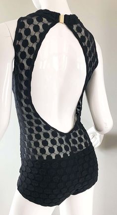 For Sale on 1stDibs - Sexy and rare 1960s GOTTEX black one piece swimsuit or bodysuit with sheer cut-out sides! Features a high neck with an open back. Black on black polka Chic Fitted Bodysuit With Back Opening, Sheer Sleeveless Bodysuit For Evening, Summer Party High Neck Bodysuit, High Neck Bodysuit For Summer Parties, Fitted Party Bodysuit With Mesh Back, Fitted Bodysuit With Mesh Back For Party, Chic Low Back Bodysuit For Party, Fitted Low Back Bodysuit For Party, Retro Fitted Bodysuit For Party