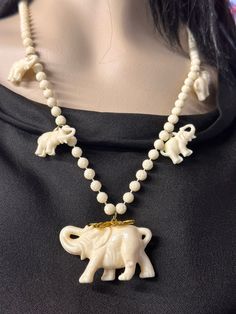 "I've seen a couple of these necklaces pop up on selling platforms, using different terminologies for the material used. Celluloid, plastic and other names. I don't know myself the correct name, but it's lightweight and free from cracks. Entire necklace measures 13\" top to feet of bottom elephant. There are no markings anywhere.  5 elephants and rosette spheres dangle vintage necklace. Even tho it's old, it's nice and clean & perfectly \"giftable\"" I Don't Know Myself, Know Myself, Elephant Walk, Vintage Elephant, Vintage Necklace, Charm Necklace, Necklace Etsy, Pop Up, Elephant