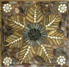 a decorative tile with rocks and stones in it