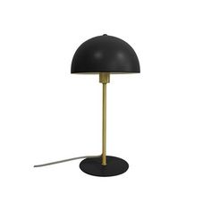 a black and gold lamp on a white background