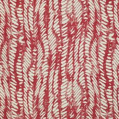 an abstract red and white pattern on fabric