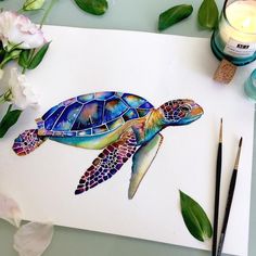 a watercolor painting of a sea turtle next to some flowers and paintbrushes