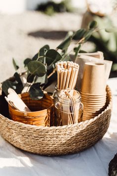 a basket filled with lots of items on top of a table