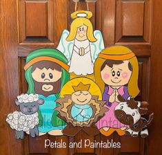 an image of the nativity scene hanging on a door