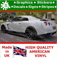 a white sports car with british flag stickers on the back and side stripes for decals