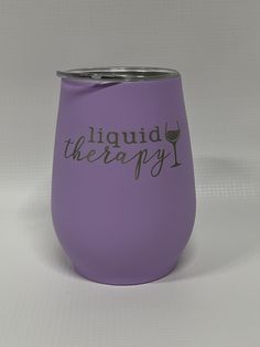 a purple wine tumbler with the words liquid therapy on it