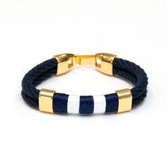 -Hand dyed navy blue cotton rope.-Gold plated clasp closure.-Gold plated spacer beads.-Hand wrapped thread detail.************************************** Sizing: If you're looking for a comfortable fit, we recommend ordering 1/2" larger than your wrist size (i.e. if your wrist measures 6.5", choose size 7"). If you're not sure, the size chart below can be used as a guide: 6.5” – Women’s Extra Small 7” – Women’s Small 7.5” – Women’s Medium 8” – Women’s Large / Men’s Small 8.5” – Women’s Extra Larg Resort Jewelry, Large Man, Jewelry For Men, Nautical Fashion, Hand Wrap, Cotton Rope, Muslin Cotton, Navy White, Spacer Beads