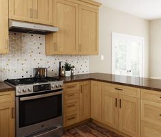 a kitchen with wooden cabinets and stainless steel stove top oven in the center of the room