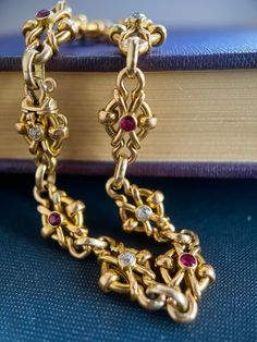 Beautiful handmade bracelet from the late Victorian/ Art Nouveau period dating circa 1900, made in 18k yellow gold, set with 5 old cut diamonds and 5 natural Rubies. The bracelet is composed of ten elements with an integrated box clasp.   Condition: Very good, some minor dent, not visible. Material: 18 k yellow gold weighing 17.5 gram, acid tested.   Gemstones: 5 natural red rubies in bezel setting weighing approx.0.50 carat combined.   Diamonds: 5 old cut diamonds in bezel setting weighing appr Luxury Victorian Bracelets For Anniversary, Luxury Antique Bracelets With Intricate Design, Luxury Victorian Oval Bracelets, Luxury Gold Victorian Cuff Bracelet, Vintage Rose Cut Diamond Bracelet, Victorian Diamond Bracelets As Gift, Victorian Diamond Bracelets For Gifts, Victorian Diamond Bracelets For Gift, Vintage Bangle Bracelet With Single Cut Diamonds