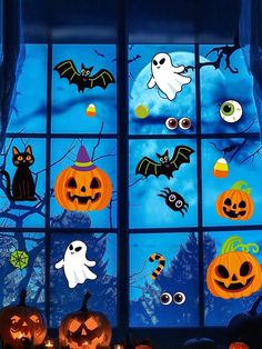 a window decorated with halloween decorations and pumpkins in front of a blue sky filled with bats