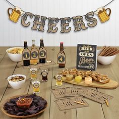 a table with beer, snacks and other items for a bachelor's day party