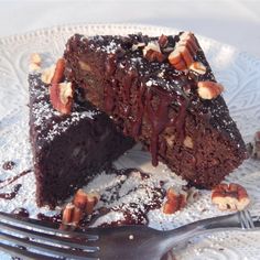 a piece of chocolate cake on a plate with a fork