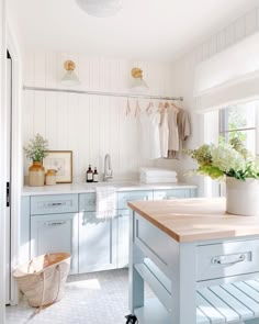 a kitchen with blue cabinets and white walls