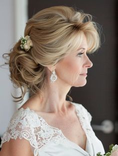 a woman in a wedding dress holding a bouquet