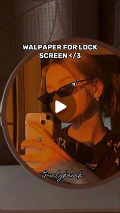 a woman taking a selfie in front of a mirror with the text wallpaper for lock screen 7 / 3