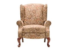 an upholstered wingback chair with floral fabric on the back and armrests