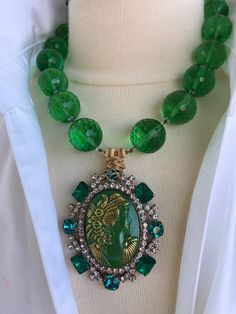 Green Antique Cameo hand knotted in green silk thread 20 mm | Etsy Vintage Green Crystal Jewelry, Elegant Beaded Green Onyx Jewelry, Elegant Green Onyx Beaded Jewelry, Green Round Crystal Jewelry, Elegant Green Jade Crystal Necklace, Green Crystal Pendant Jewelry, Luxury Green Faceted Necklaces, Luxury Faceted Green Necklace, Luxury Green Faceted Necklace