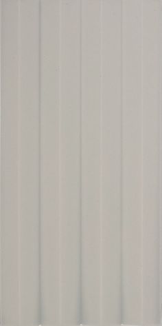 a white wall with vertical slats on it