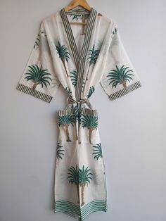 "HandicraftTex presenting good looking Cotton kimono robes which are perfect for lounging around the home or spa. Use our Bird print robe as a cover up on the beach or after a dip in the pool. Add a luxe, boho feel to your bridal shower. Versatile, soft and luxurious, our 100% cotton kimono robes are printed with azo-free dyes. The printed robe features 3/4th sleeves, a waist tie and two front pocket.Indian Kimono, Kimono, Cotton Robe, Robes, Dressing Gown, Women Wear, fridakahloprint robe, bridal shower, soft, Kimono Robes,dressing gown women, cotton bath robe, kimono robe, cotton robe, womens bath robe, womens dressing gown, robe, boho, vintage, dressing gown, loungewear, kimono, cotton Size - One size will fit sizes S to XL Length - 48 inches (125 Centimeter), mid calf Note: Girl wear t Green Wrap Kimono For Vacation, Green Long Sleeve Kimono For Beachwear, Green Open Front Kimono For Vacation, Traditional Open Front Kimono For Vacation, Green Kimono With Kimono Sleeves For Vacation, Traditional Kimono With Kimono Sleeves For Vacation, Traditional Wrap Kimono For Vacation, Green Kimono For Beachwear, Traditional Open Front Summer Robe