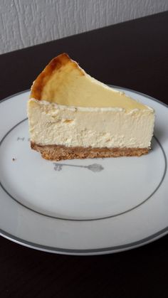 a piece of cheesecake sitting on top of a white plate