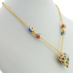 Every woman loves to own unique handcrafted jewelry. This Murano necklace in rich gold and millefiori palette is every woman's dream, rich and beautiful like Venice itself. The authentic Murano necklace features an exquisite 24K gold-layered heart pendant suspended from an elegant gold-lined beaded necklace accented with gorgeous 24K gold-lined and millefiori Murano glass beads. Enjoy this unique Murano Necklace and the aura of Venetian romance and elegance that it projects. Measurements: The he Gold Necklaces With Heart Beads For Jewelry Making, Elegant Multicolor Heart Beads Necklace, Elegant Multicolor Heart Pendant Necklace, Gold Murano Glass Jewelry As Gift, Gold Murano Glass Jewelry For Gifts, Gold Murano Glass Jewelry Gift, Elegant Multicolor Heart Necklace For Gift, Elegant Multicolor Heart Necklace Gift, Gold Murano Glass Necklace For Gift