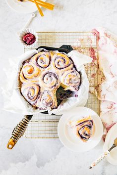 a table topped with a pie covered in icing