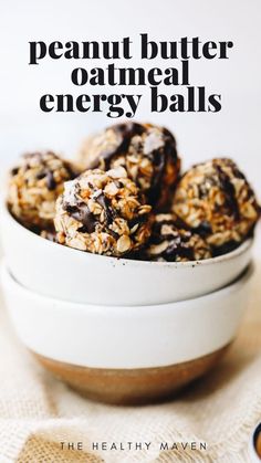 a bowl filled with granola energy balls on top of a table