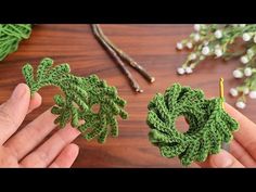 crocheted wreaths are being displayed on a table