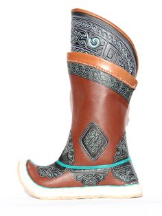 "Mongolian boots are originally made for convenient of horse riders when they are galloping; therefore, they are feet-friendly, exceptionally solid and having good quality soles. A significant difference in the process of making Mongolian shoes compared to other leather boots is not using the mold. For the first few days, you may feel tough with your boots, but soon it will break in and you will be satisfied. It has double \"zulag\" in the sole. Bottom of the boots made of cowhide. Rubber soles Traditional Black Boots With Leather Sole, Traditional Ankle Boots With Leather Sole, Traditional Leather Boots With Rubber Sole, Traditional Black Leather Boots, Traditional Closed Toe Boots With Leather Sole, Traditional Brown Boots With Round Toe, Traditional Brown Closed Toe Boots, Mongolian Shoes, Mongolian Boots