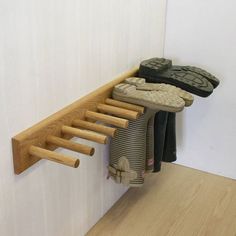 there is a wooden rack with shoes on it