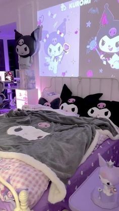 a bedroom with purple and white decor on the walls, including a cat bedding set