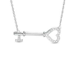 Sweet and charming, this glittering diamond key necklace is certain to be treasured. Crafted in sleek sterling silver, this sideways style is crowned by a heart-shaped open bow encrusted with dazzling diamonds. The sparkling bit is also lined with diamonds to complete the look. Glistening with 1/10 ct. t.w. of diamonds and a bright polished shine, this key suspends centered along an 18.0-inch rope chain that secures with a spring-ring clasp. Sterling Silver Heart Necklace, Sterling Silver Rings Set, Heart Key, Heart And Key, Silver Heart Pendant, Local Jewelry, Key Necklace, Classic Jewelry, Sterling Silver Heart