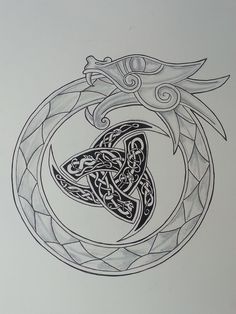 a drawing of a dragon in the middle of a circle with an intricate design on it