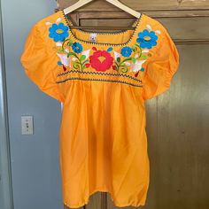 Excellent Condition, Never Worn! So Cute On. Size M Summer Embroidered Orange Blouse, Orange Embroidered Summer Blouse, Summer Orange Embroidered Blouse, Spring Embroidered Orange Blouse, Orange Embroidered Tops For Summer, Orange Floral Embroidered Top For Summer, Casual Orange Embroidered Blouse, Yellow Casual Short Sleeve Embroidered Top, Casual Yellow Embroidered Short Sleeve Top