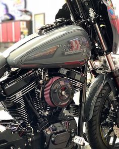 a close up of a motorcycle parked in a parking lot