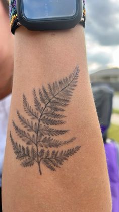 a close up of a person's arm with a tattoo design on the wrist