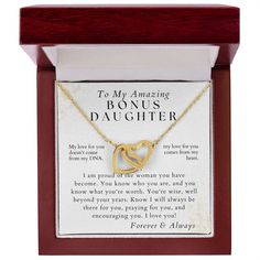 a necklace in a wooden box with an inscription on it that says, to my beautiful daughter