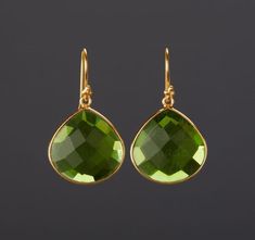 A pair of large green quartz set in gold plated bezel:1. Stone color: green2. Stone size: (22 x 20 mm)3. earring total length ~36 mm4. bezel material: gold plated5. earring hook: gold plated Packaged in a very pretty and presentable gift box.Earrings in other colors are available. Please browse my other earring listings or send you inquiry. Elegant Handmade Green Teardrop Earrings, Formal Green Teardrop Gemstone Earrings, Peridot Teardrop Earrings For May Birthstone, Teardrop Peridot Earrings For May Birthstone, Green Natural Stone Drop Earrings, Green Natural Stones Drop Earrings, Gold Teardrop Peridot Earrings, Green Peridot Teardrop Earrings, Luxury Green Teardrop Gemstone Earrings