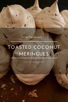 a pile of tastyed coconut meringues sitting on top of a wooden table