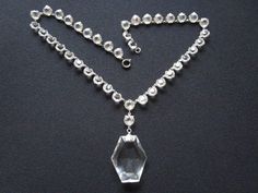 "Collector's Piece... Lavishly Stunning Vintage Antique Art Deco Circa 30's 40's Faceted Round & Fancy Shaped Open Back Prong Setting Sparkling Clear Crystal/Glass Glamorous Evening Cocktail Necklace Classic Wedding Jewelry! I am delighted to offer this stunning elegant gorgeous vintage antique Art Deco from the 1930's/40's era, Shiny silver tone cocktail necklace lavishly decorated with individual links of open backed prong/bezel set crystal glass stones all along the neckline with a larger Antique Crystal Wedding Necklaces, Antique Crystal Necklaces For Wedding, Vintage Clear Necklace For Wedding, Vintage Clear Necklaces For Formal Occasions, Art Deco Crystal Necklace For Wedding, Cocktail Necklace, Gold Chain Jewelry, Evening Cocktail, Antique Art Deco