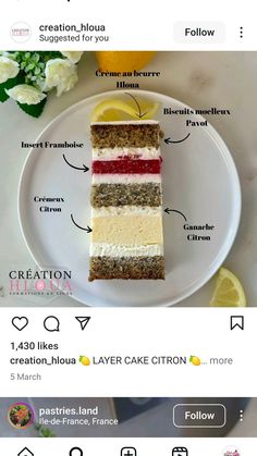 a white plate topped with a piece of cake next to a lemon slice and flowers