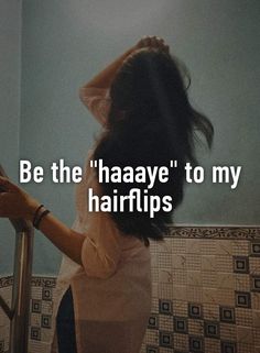 a woman standing in front of a mirror with the words be the haaye to my hairtips