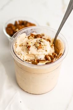 a dessert in a plastic container with a spoon