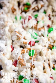 a close up view of some kind of candy mix with white and green sprinkles