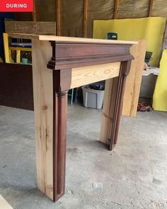 a wooden fireplace surround being built in a garage with the words during written on it