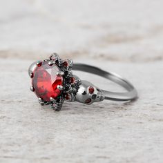 Skull Engagement Ring For Her Red Garnet Vampire Skull Ring Gothic Red Ruby Promise Ring, Red Halloween Ring, Elegant Red Skull Ring For Gift, Red Ring Jewelry For Halloween, Gothic Ruby Promise Ring, Gothic Round Ruby Jewelry, Gothic Red Gemstone Jewelry, Red Gothic Gemstone Jewelry, Red Skull Ring For Anniversary