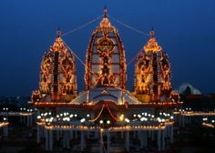 an elaborately decorated building with lights on it