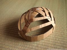 a paper mache ball sitting on top of a rug