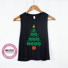 a women's black tank top with an image of a christmas tree on it