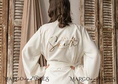 Elegant Fitted Cream Robe, Fitted Cream Wedding Robe, Fitted Cream Robe For Wedding, Cream Long Sleeve Wedding Robe, Elegant Fitted Bride Robe, Elegant White Honeymoon Dress, Cream Long Sleeve Robe For Wedding, Long Sleeve Cream Robe For Wedding, Elegant Satin Robe For Honeymoon